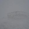 ようやく見つけた山頂碑。九合目からは前も向けない吹雪の中でした。