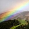 AM７：５０　山麓から見上げる八方尾根に大きな虹がかかりました。